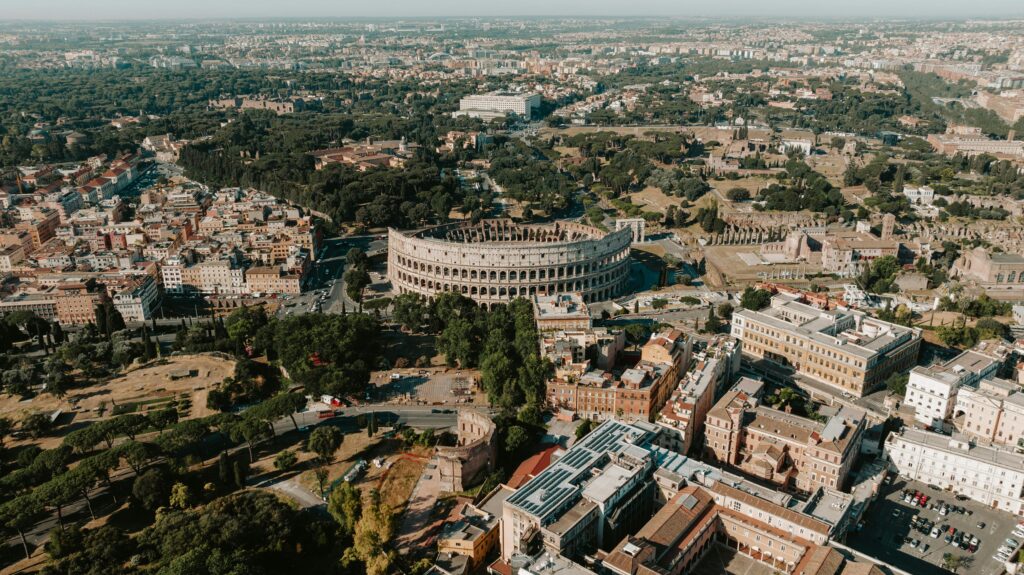 Aerial view of the Colosseum and surrounding ancient ruins in Rome, Italy
